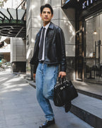 Male model carrying the Sogno 40 Bag outdoors.